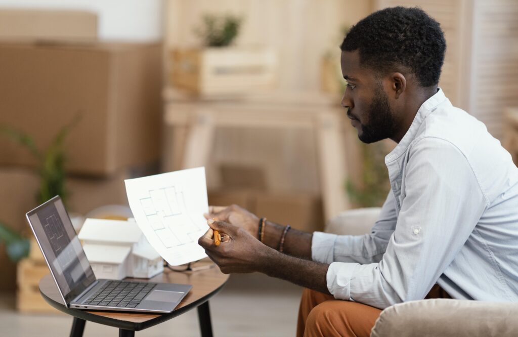 side view man making plans